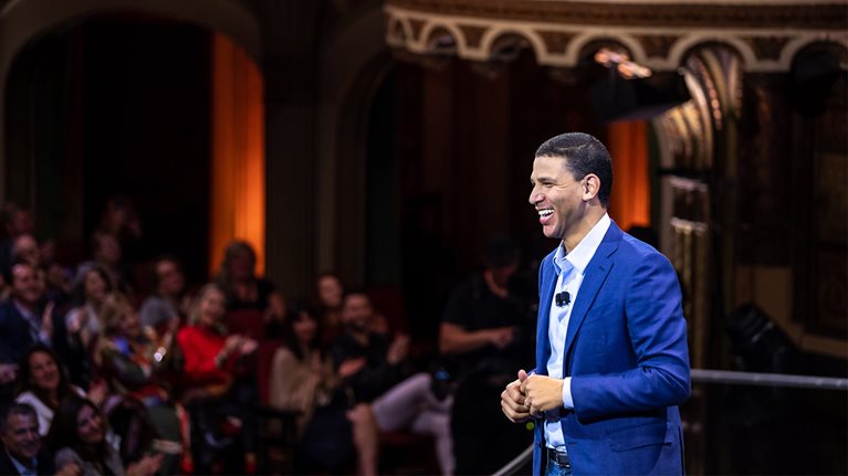 Robert Reffkin speaks to an audience about Compass