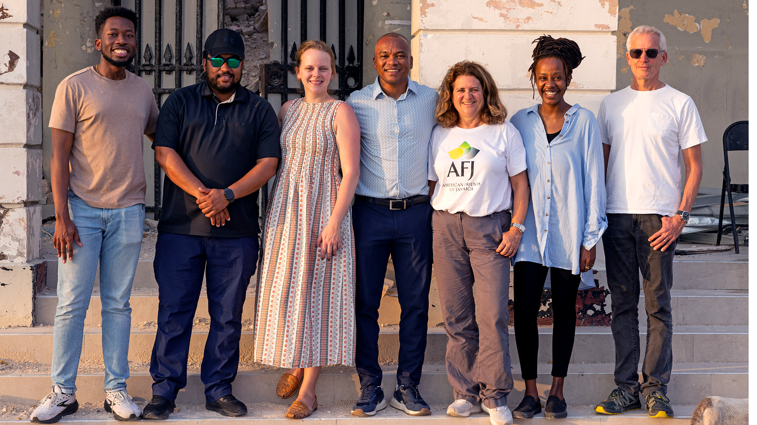 A group of seven people standing side by side