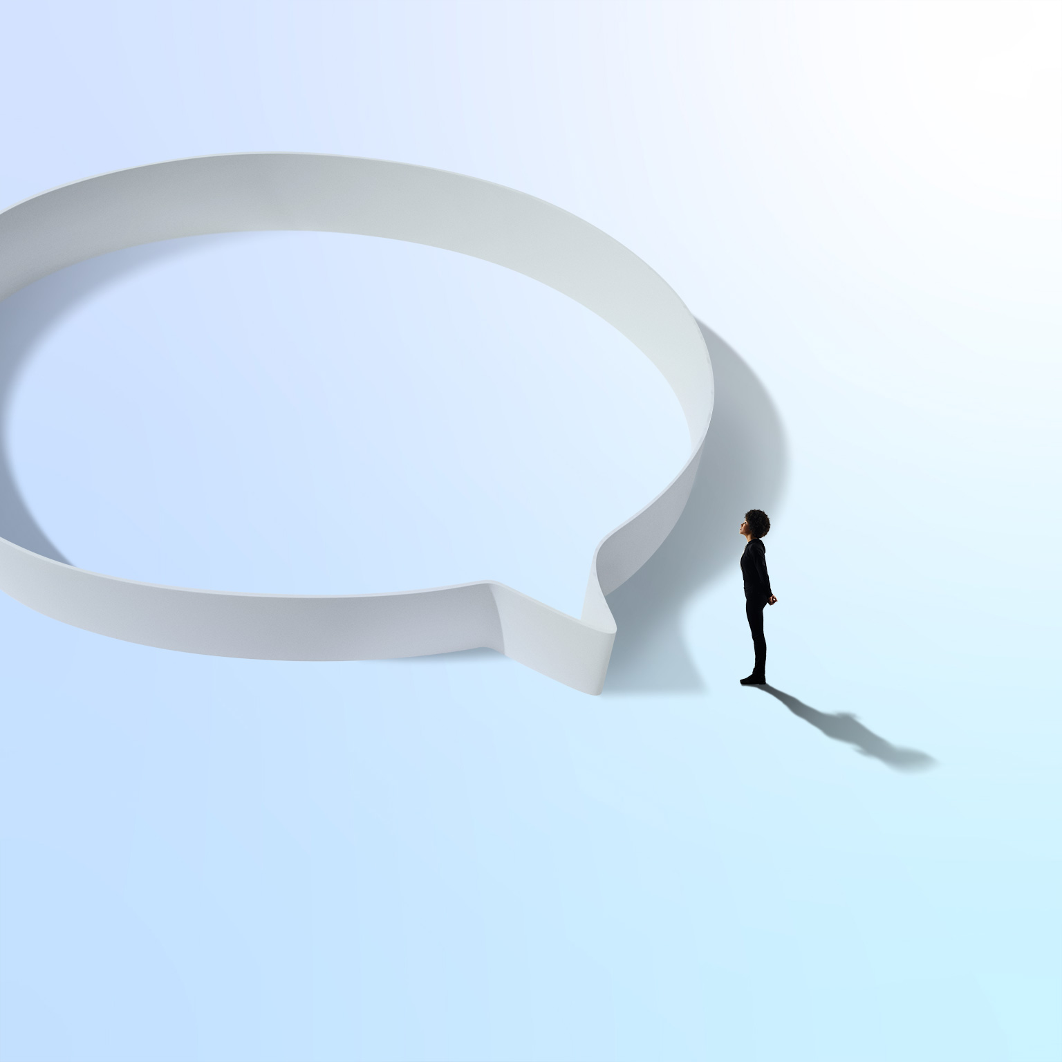 Woman in black standing near a circular hoop