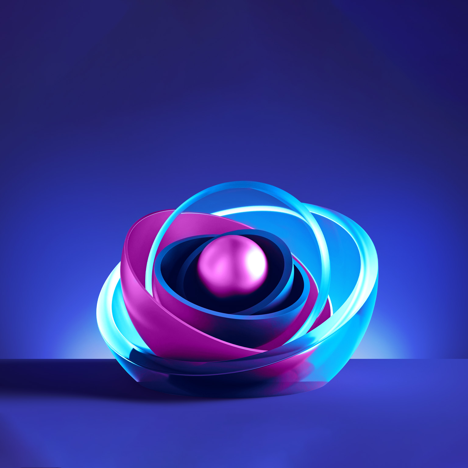 A colorful and dynamic 3D illustration featuring interconnected and swirling shapes in shades of blue and magenta. At the center of this intricate structure, a smaller magenta sphere is nestled, surrounded by half spheres in a light blue hue.