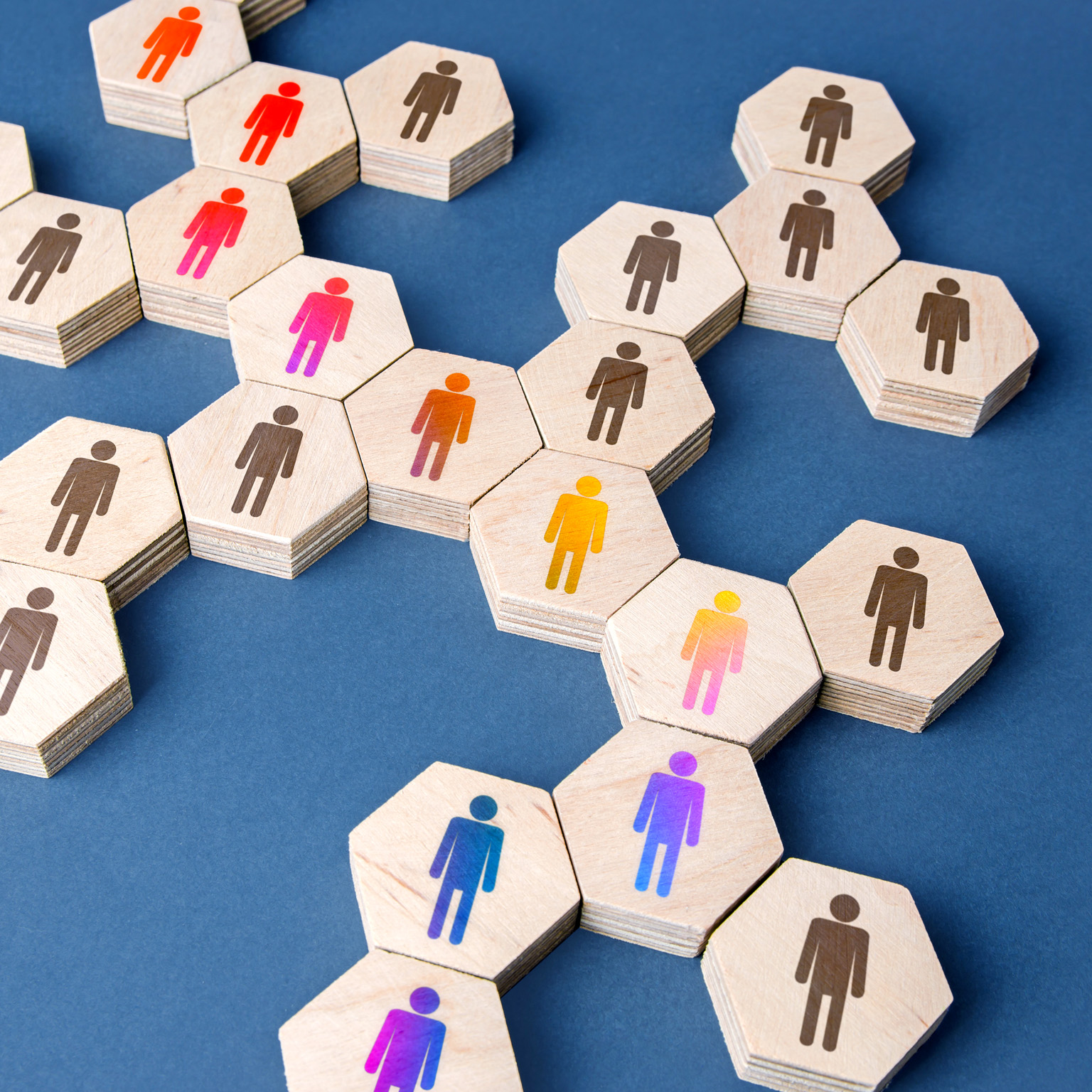 A network or chain of puzzle pieces with people on them