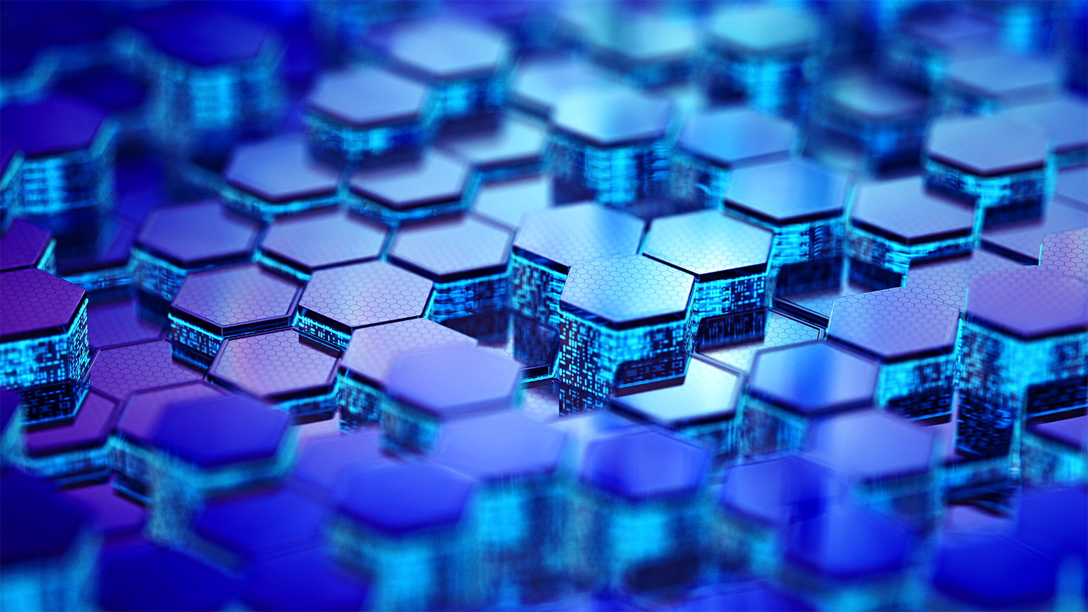 A 3D abstract image of digital glowing hexagons of varying heights networked together.