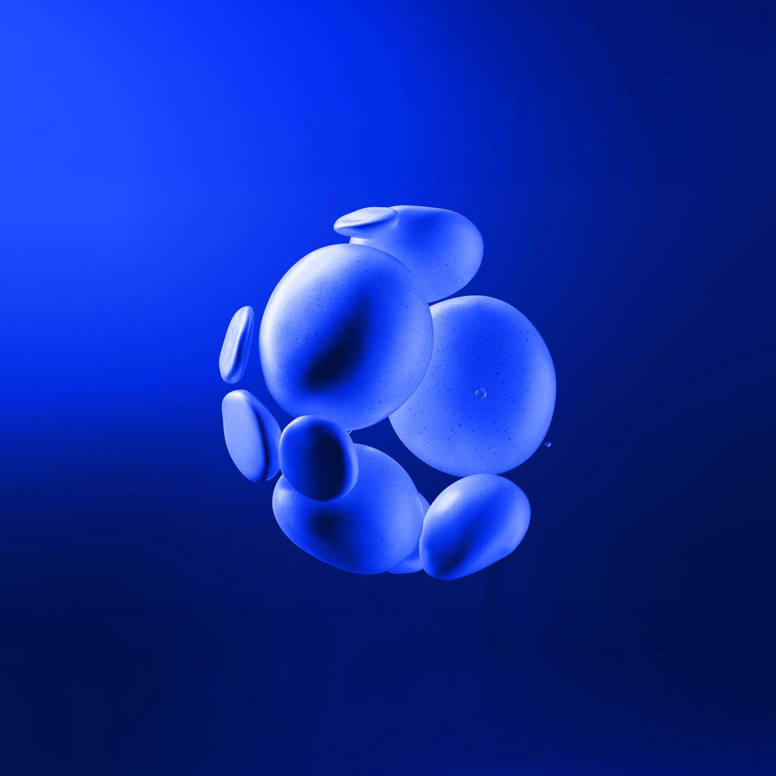 A cluster of smooth, blue, rock-like shapes seemingly floating against a deep blue background. The shapes vary slightly in size and are clustered together, creating a visually interesting, abstract form.