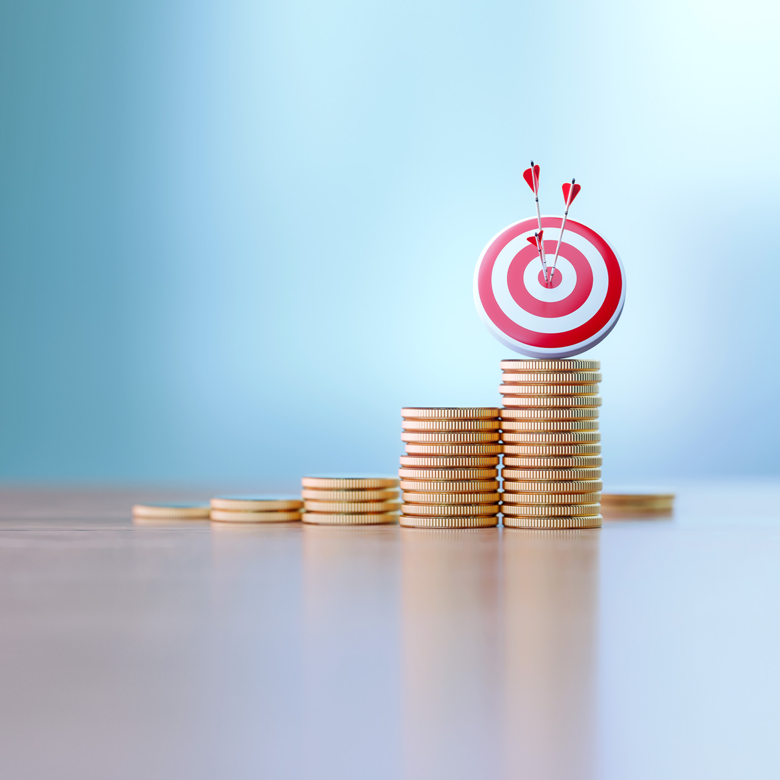 Red dartboard and arrows sitting before defocused background