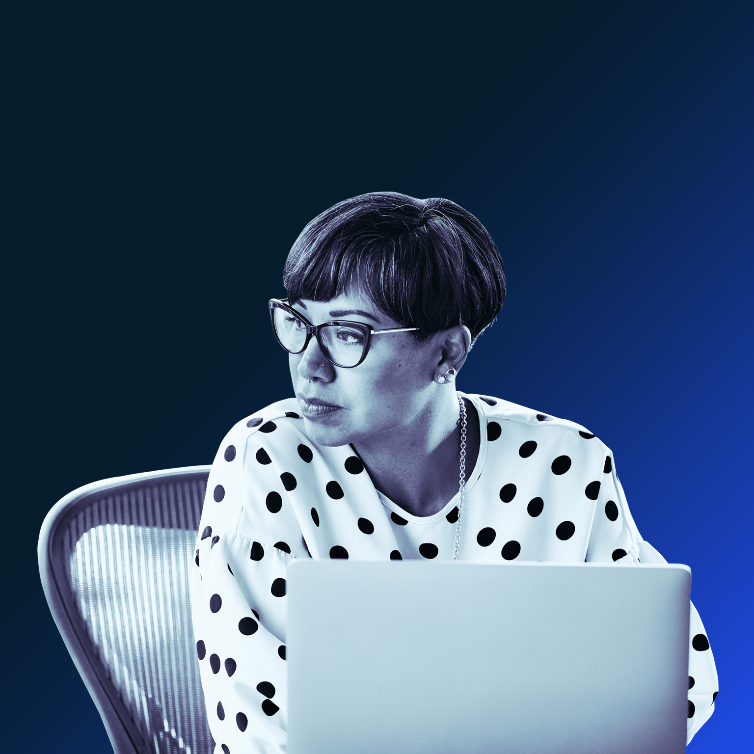 Portrait of businesswoman working on laptop at workstation