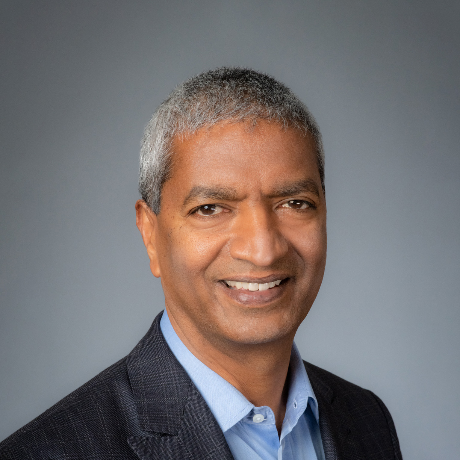 Smiling portrait of KR Sridhar