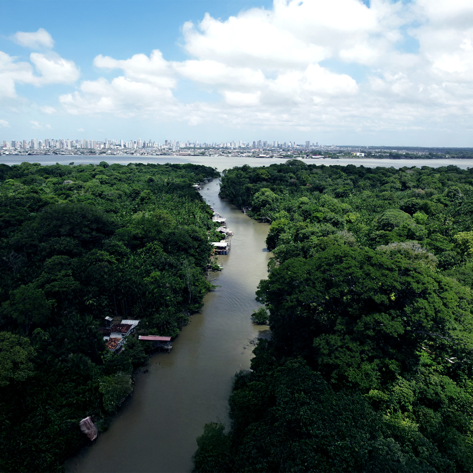 Aerial video that shows a river in the Amazon forest leading to the city of Belem, Brazil.