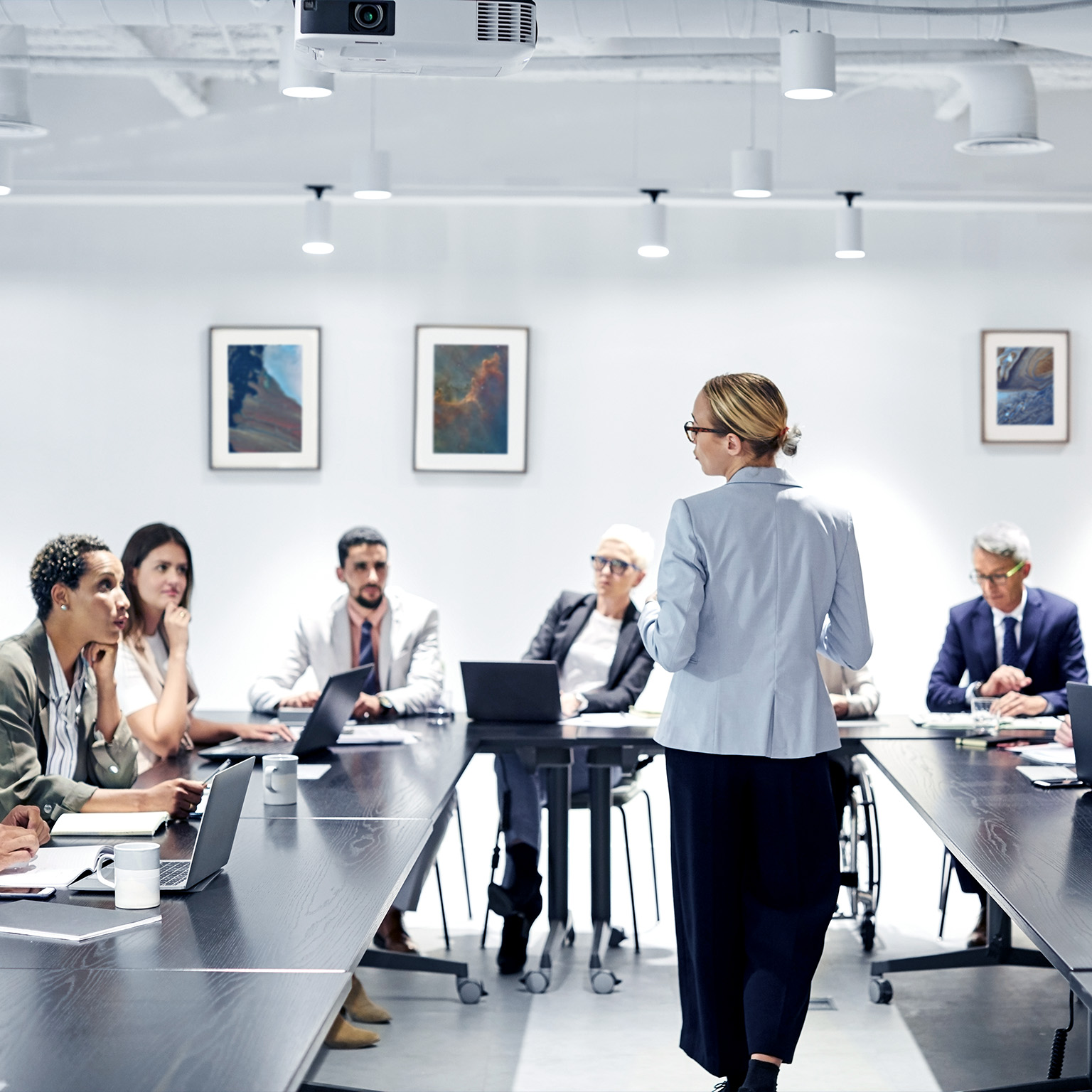 Businesswoman sharing ideas with colleagues