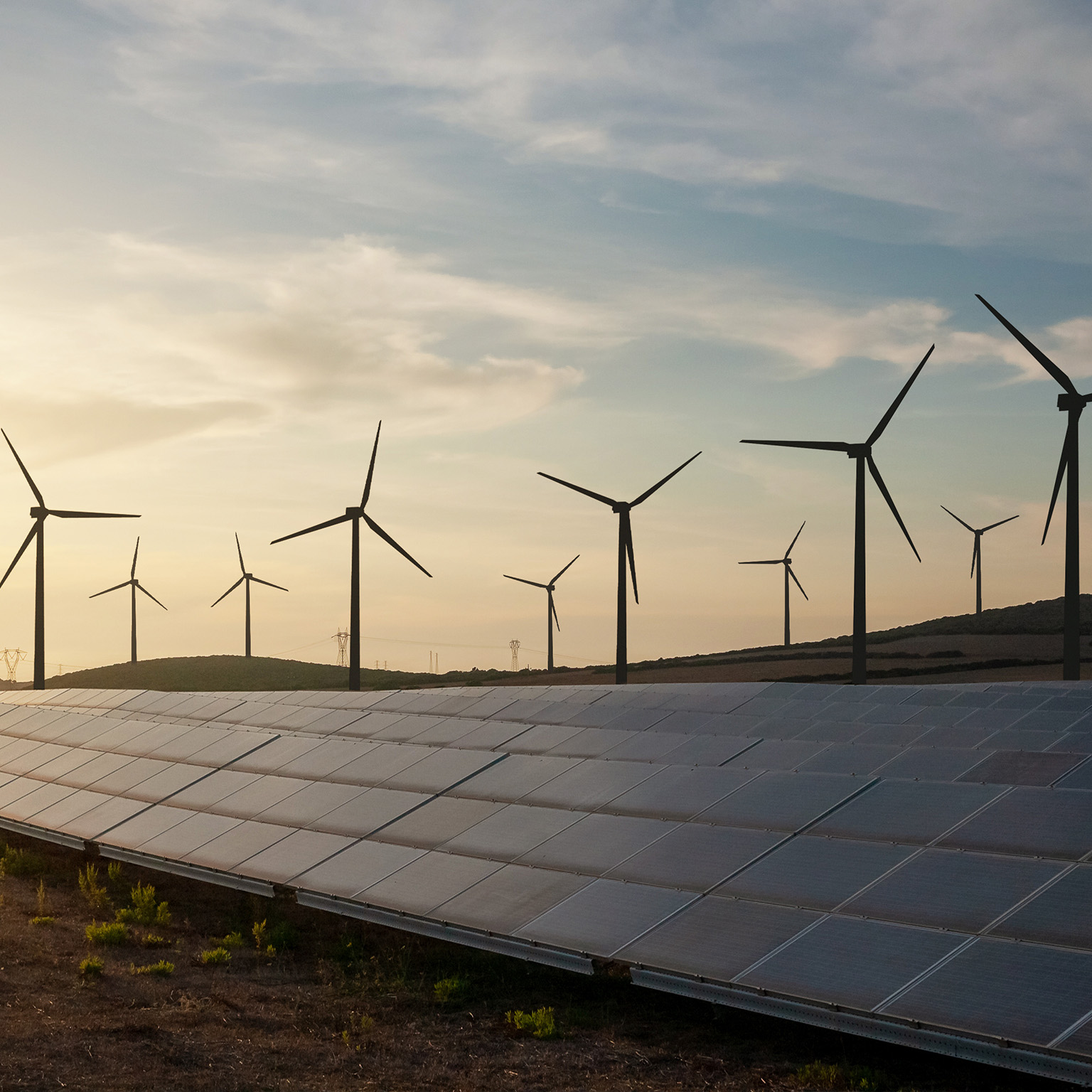 Solar and wind energy farm - stock photo