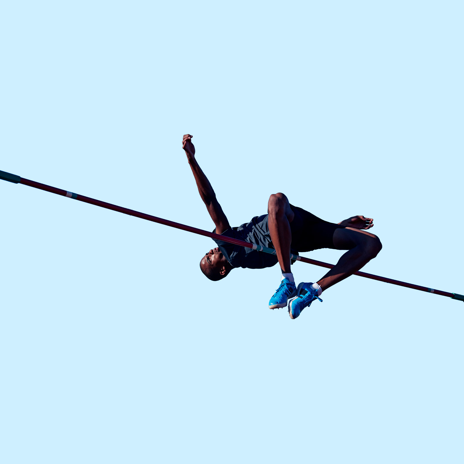 Male athlete doing high jump