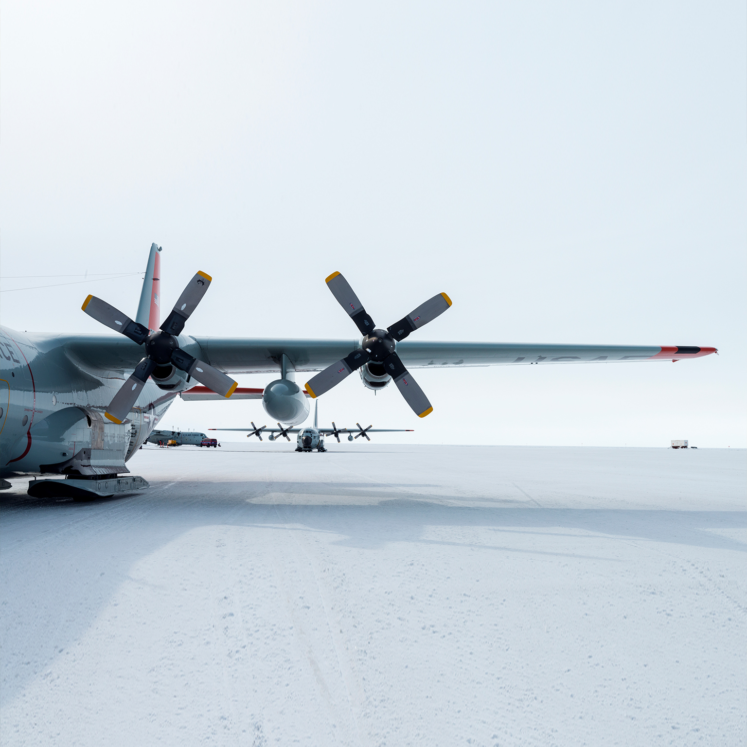 US Air force Hercules resting on skis on a sea ice tarmac. - stock photo