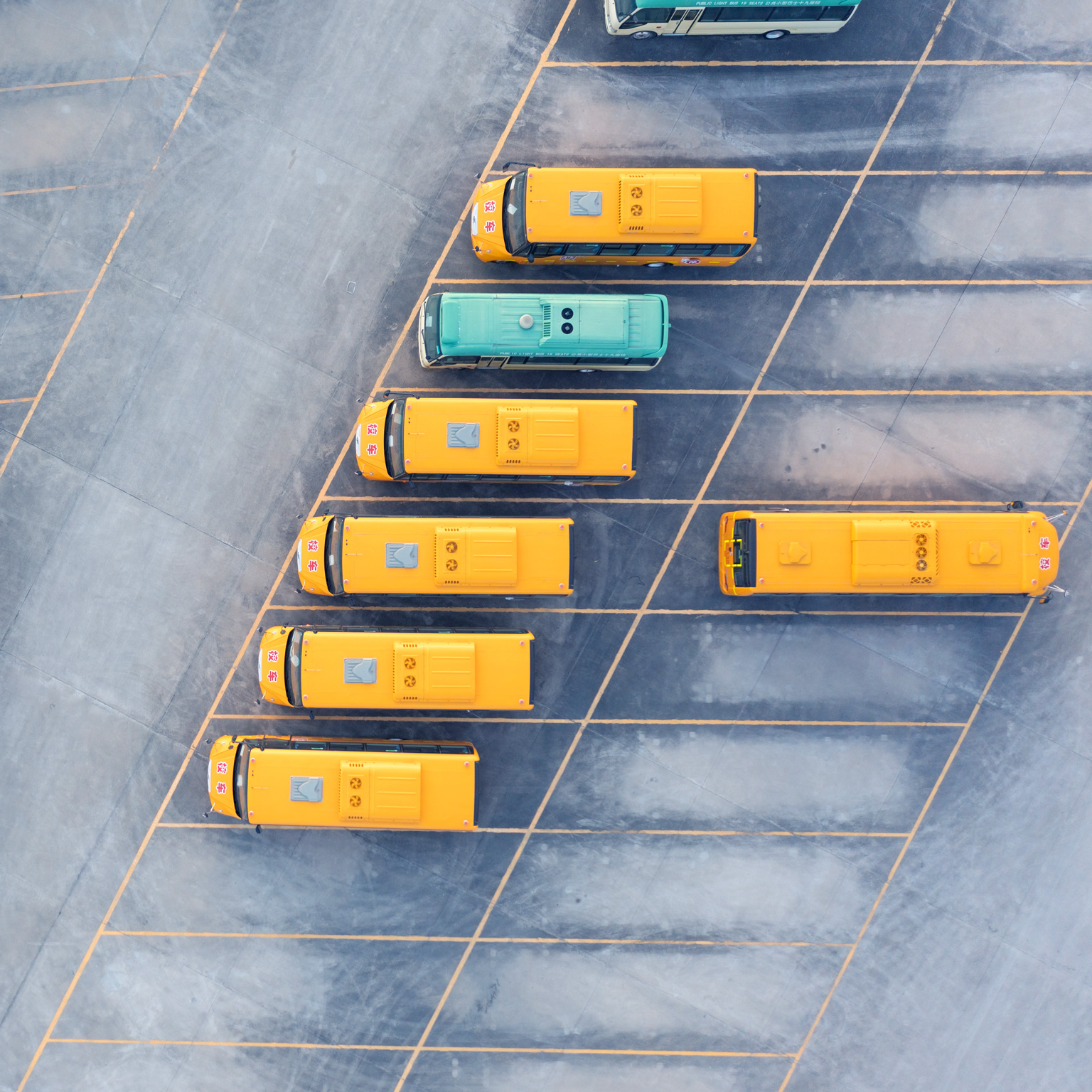 Aerial view of electric bus at factory parking lot.