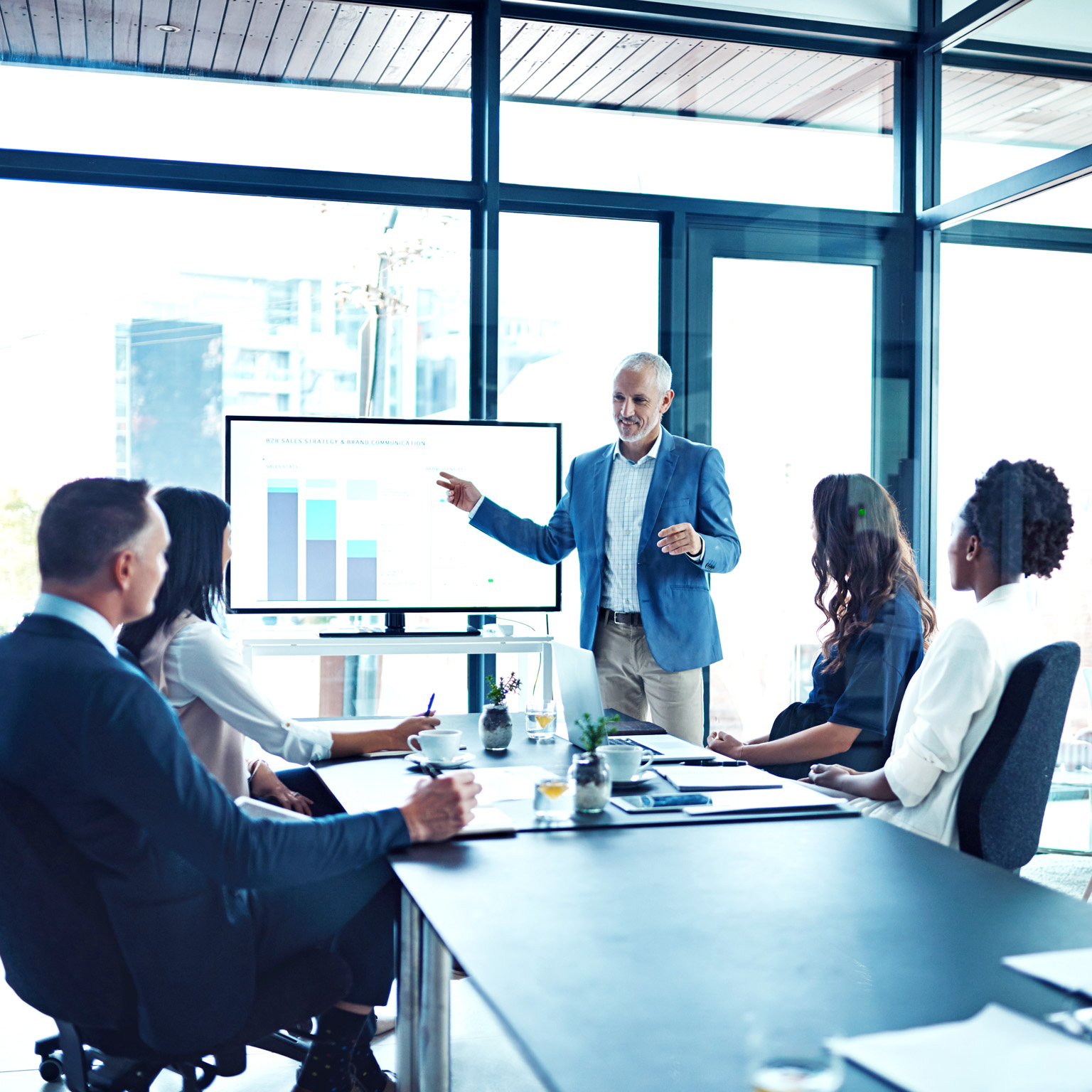 Businessman giving a presentation in a boardroom