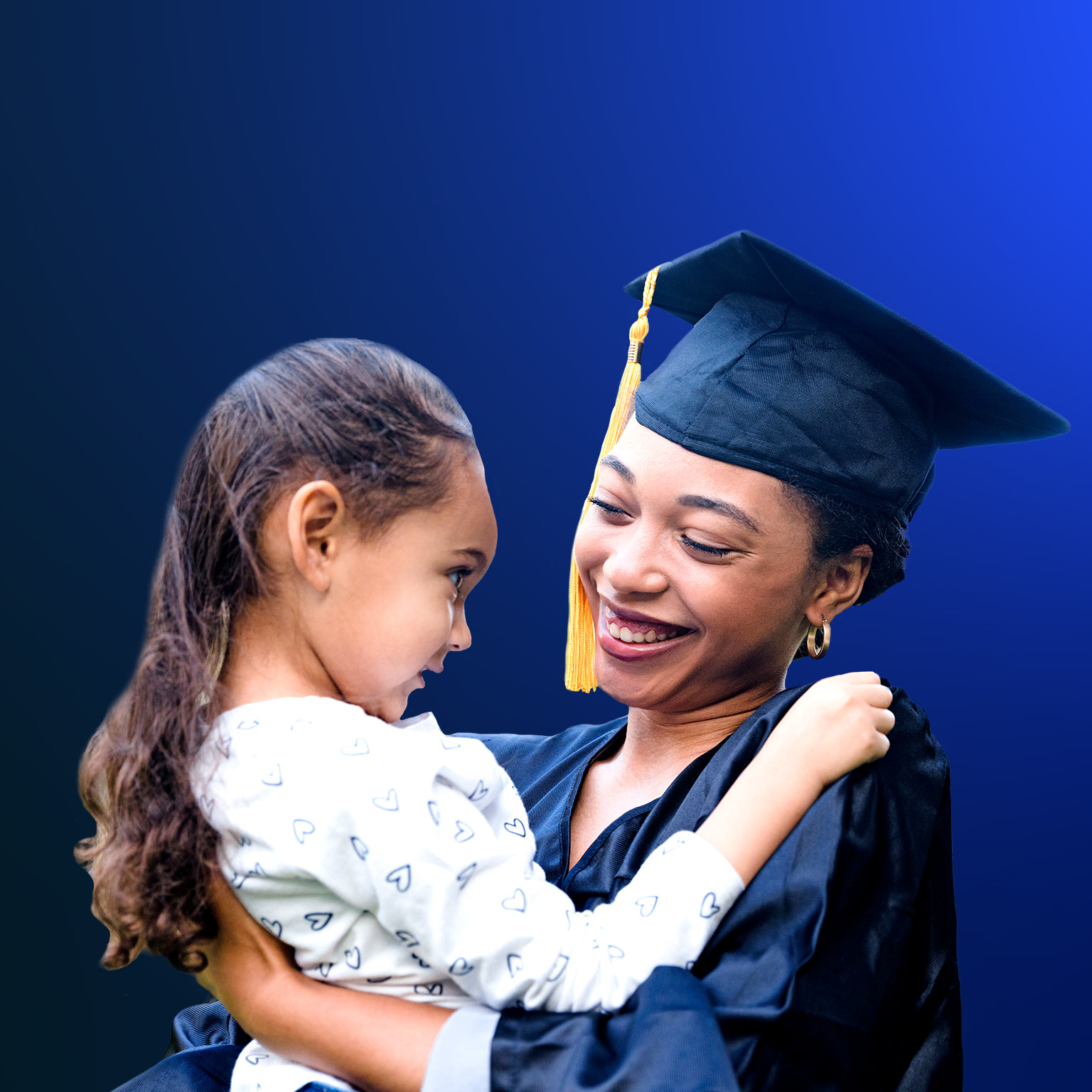 Preschool girl smiles at her mother after the graduation ceremony - stock photo