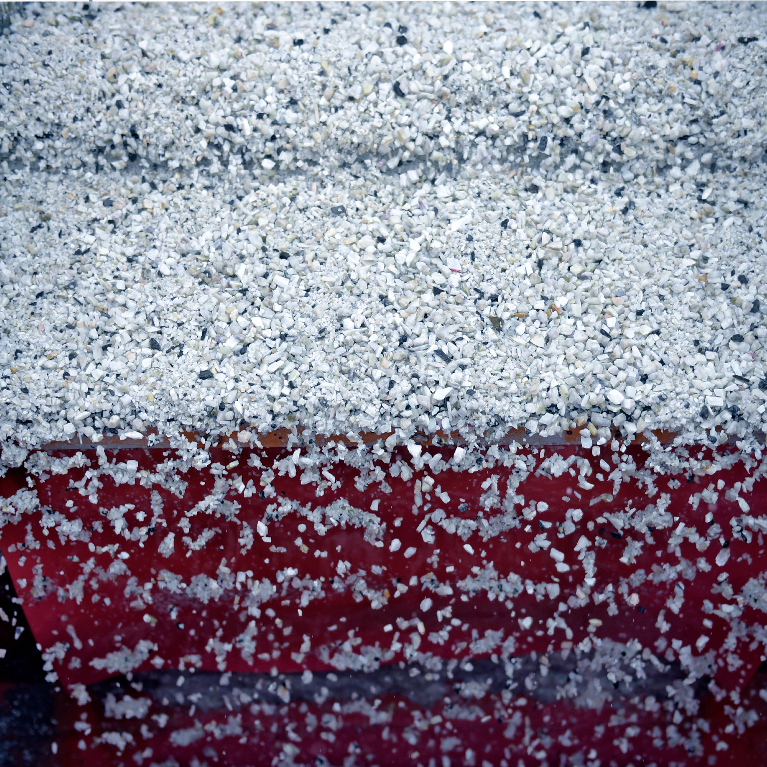 Lithium ore falls through a separation machine