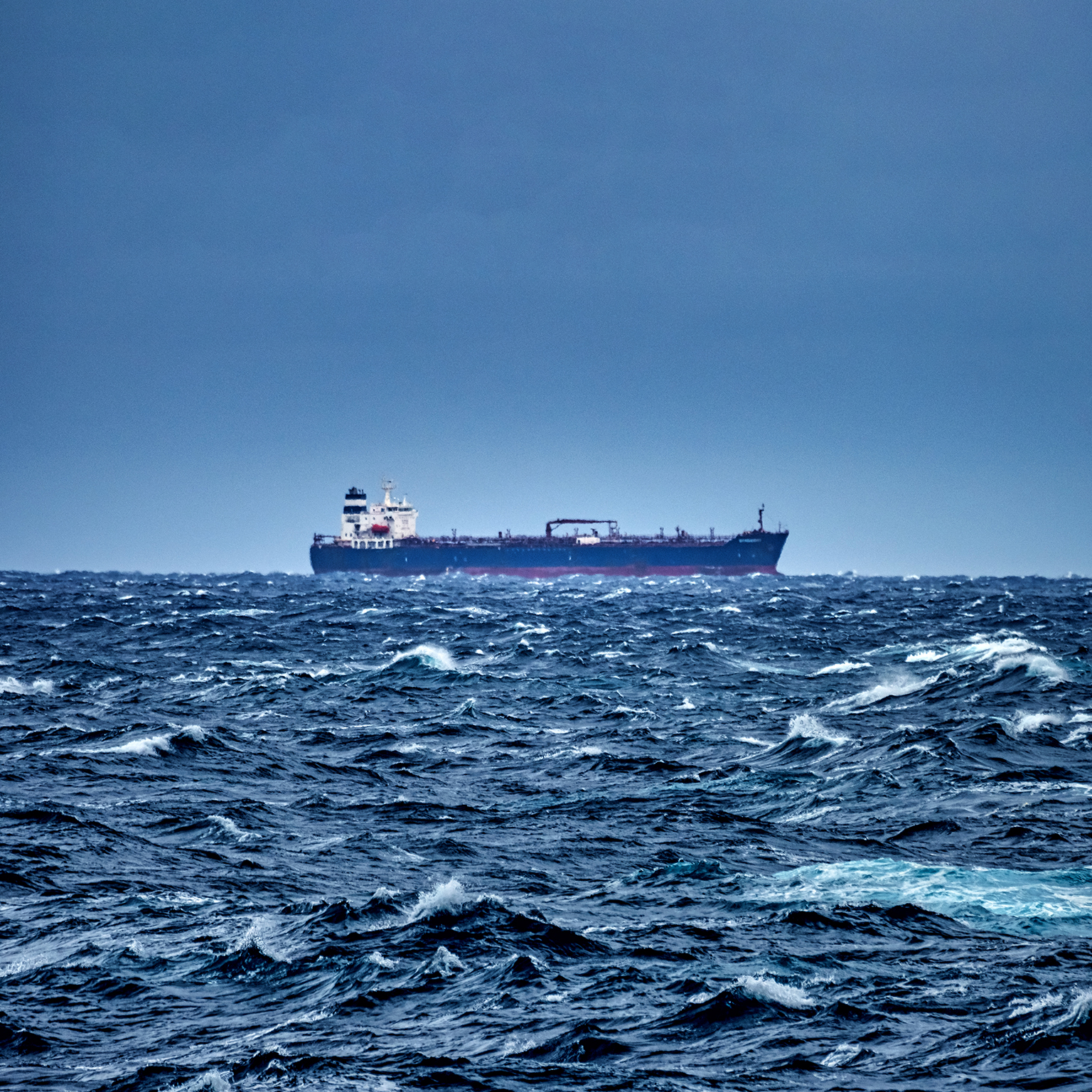 Ship delivering cargo in the stormy Mediterranean sea