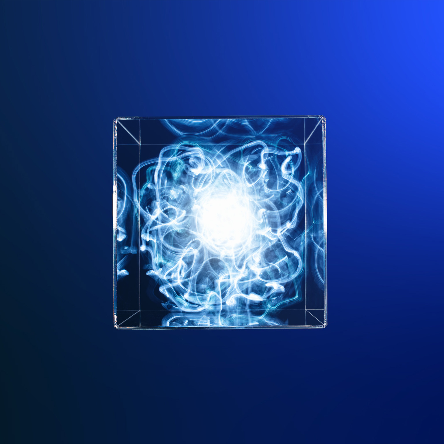 Trail of blue light contained in a clear box