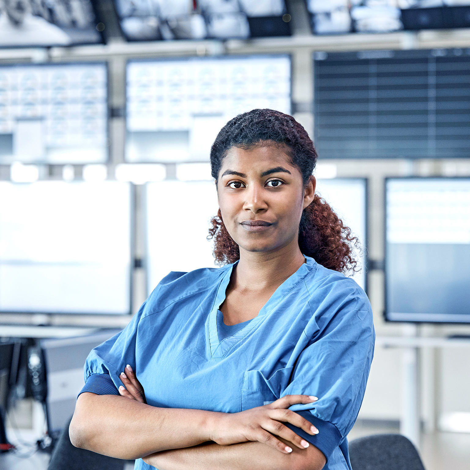 Hospital administrator conducts staff meeting