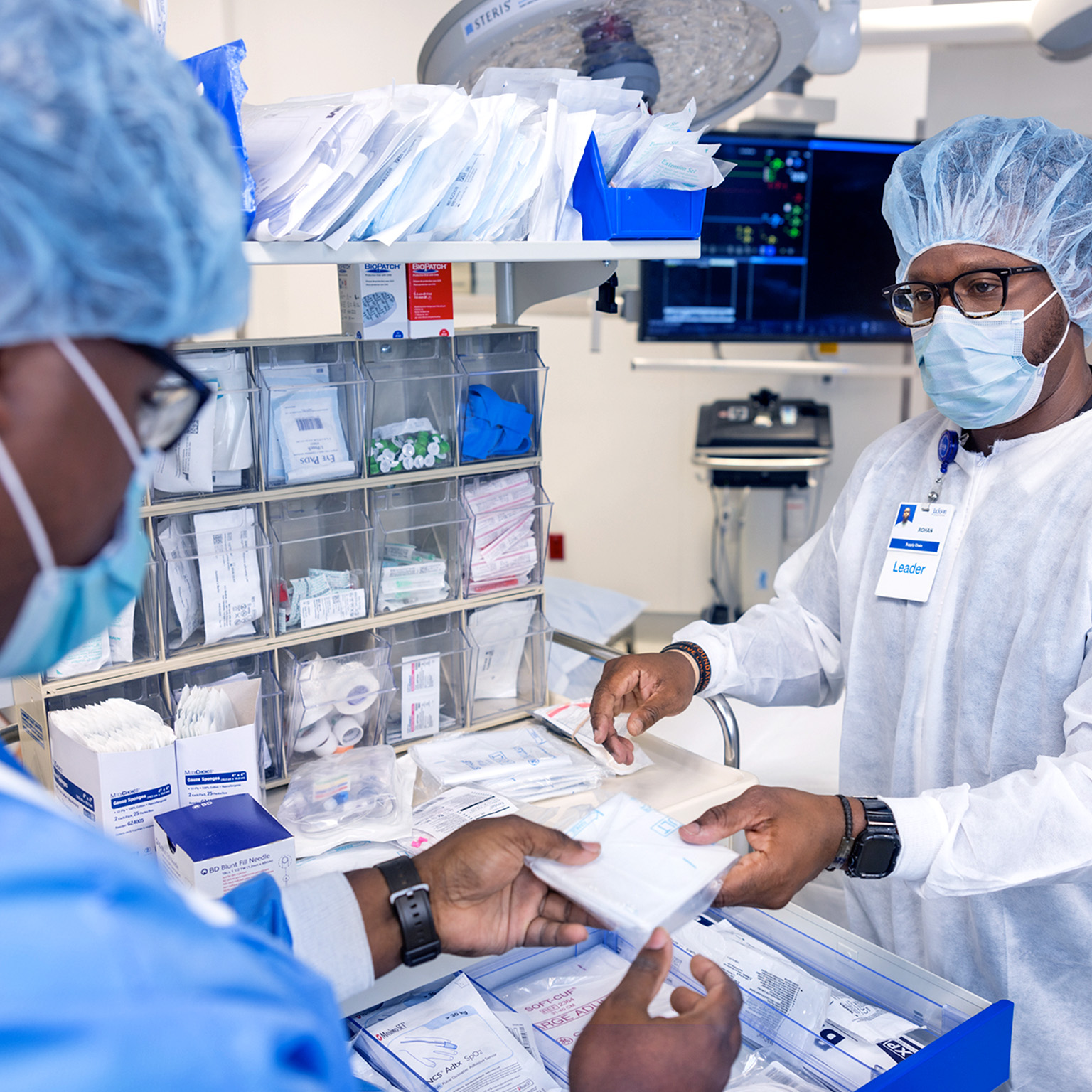 Healthcare professionals organizing medical supplies in clinical setting