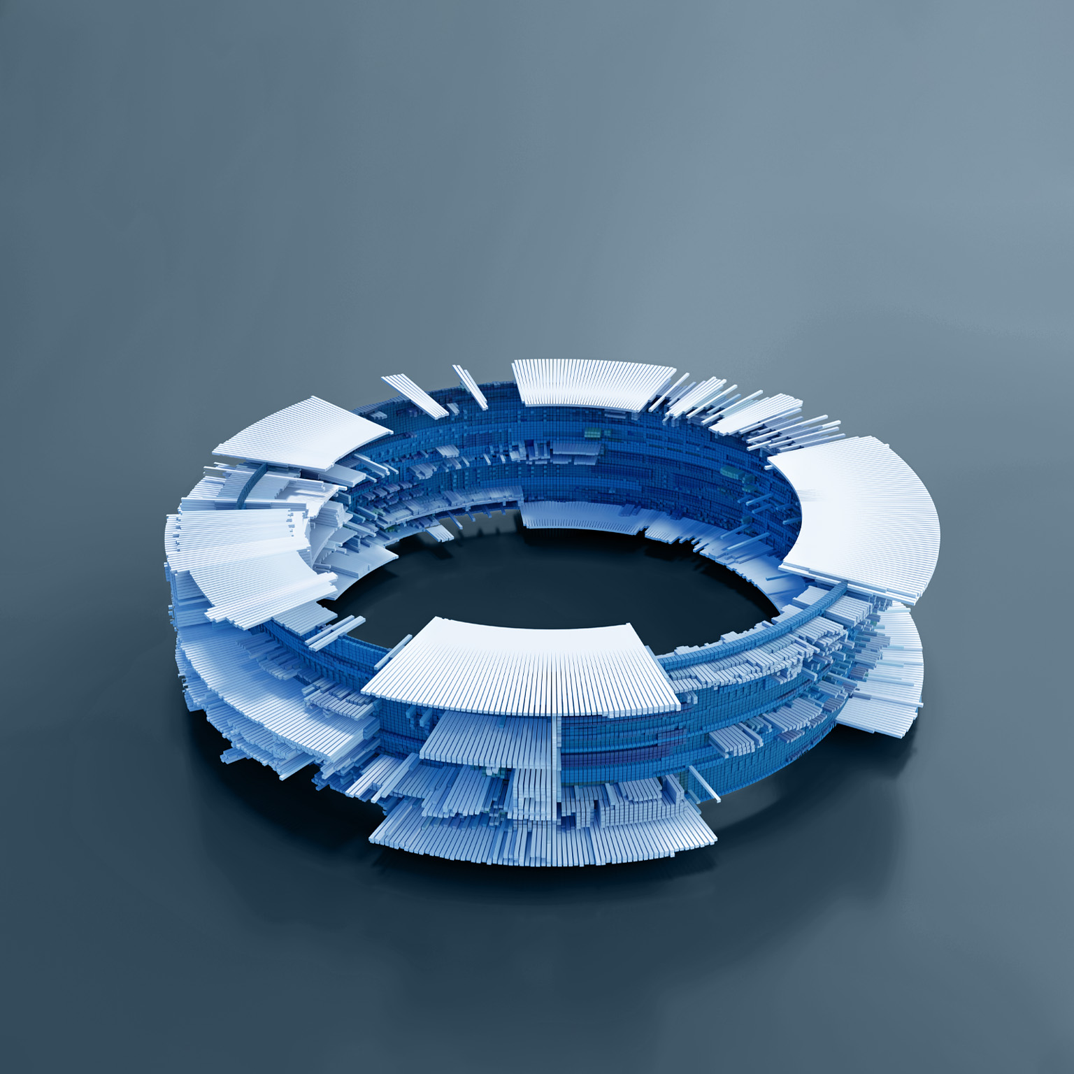 A circular structure composed of numerous small, rectangular blocks in shades of blue and white. The structure resembles a complex, futuristic computer component, with layers of blocks creating an intricate design.