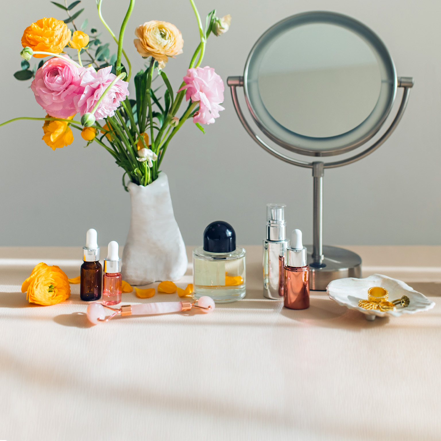 Mirror and cosmetic products on a table