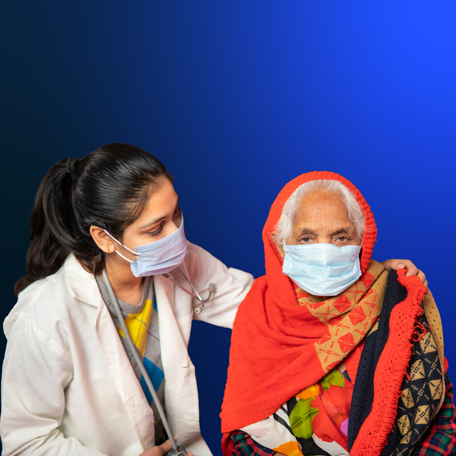Indian female doctor comforting and giving mental support to senior woman patient at home.