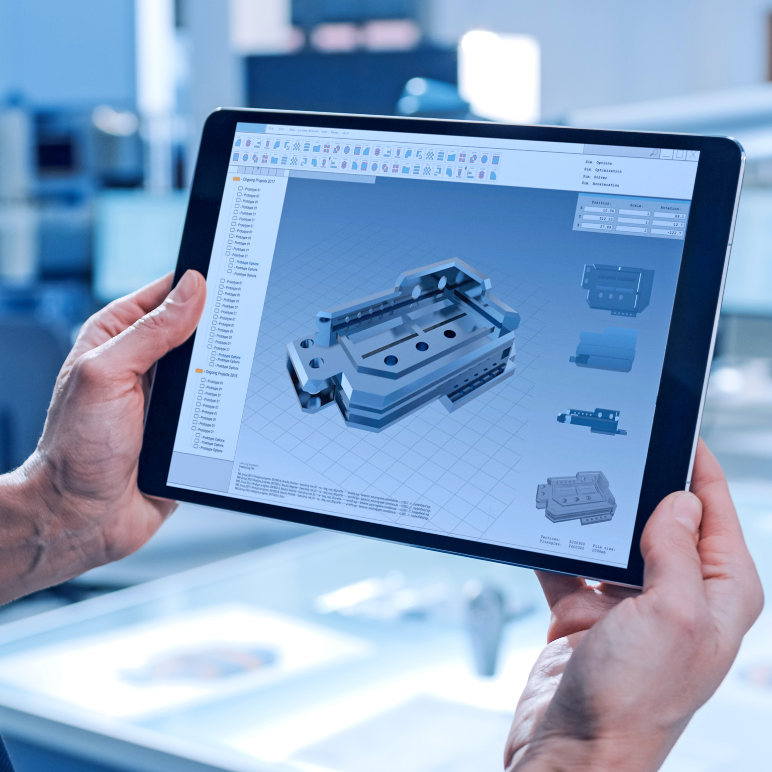 A worker using a tablet computer to operate machinery.