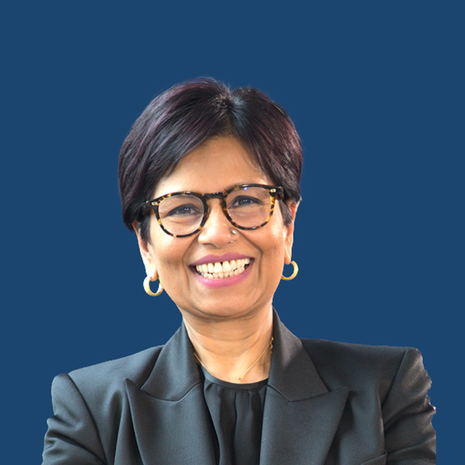 A smiling portrait of Amazon Web Services Managing Director, Tanuja Randery