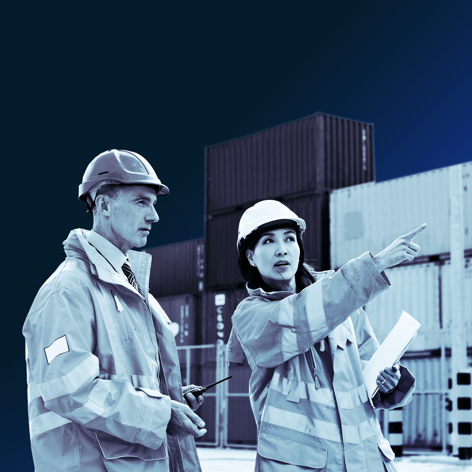 Two dock workers talking together while standing in a dockyard