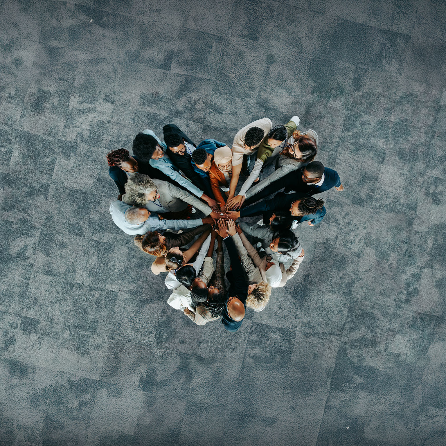 Top view of a a heart shape of people, showing unity and teamwork