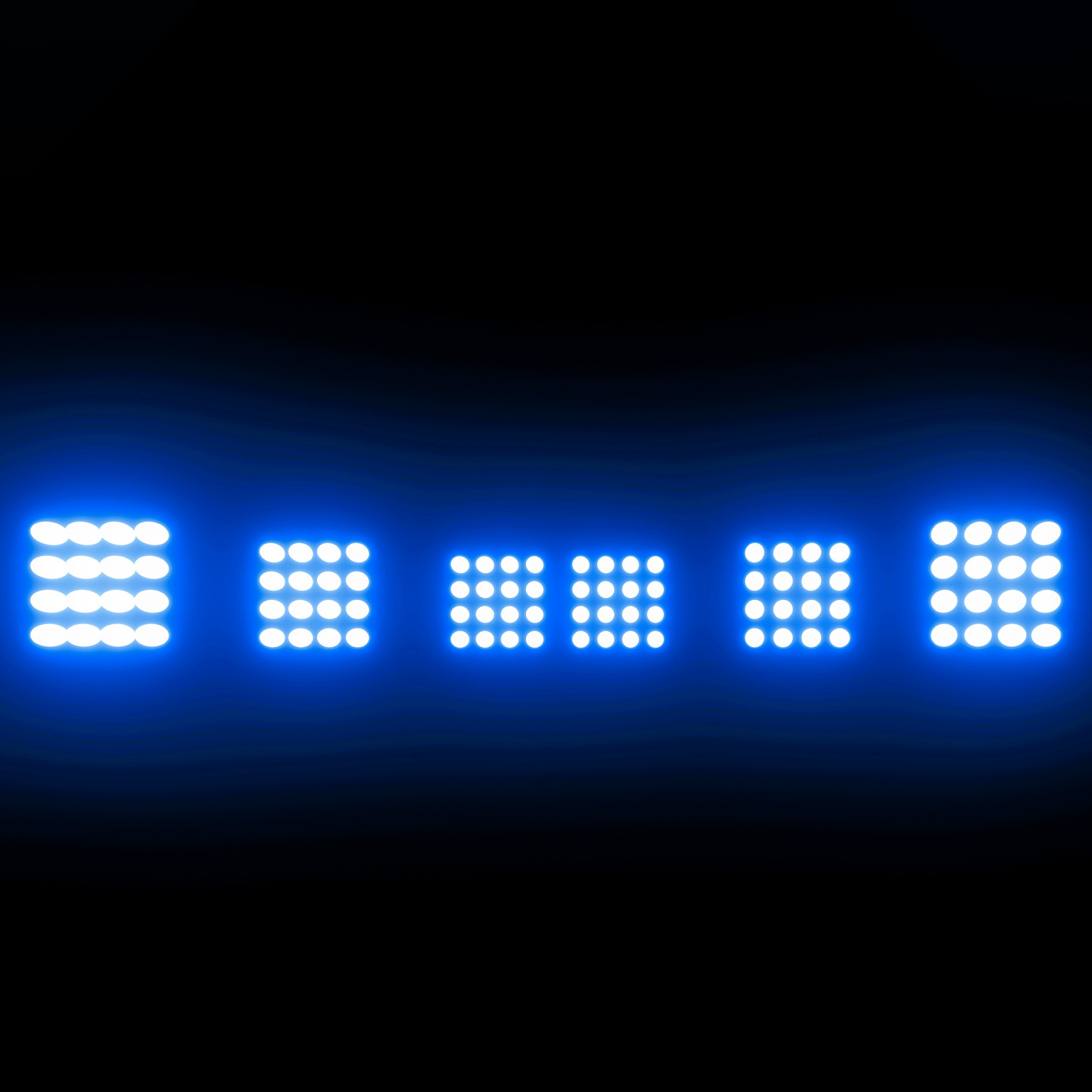 A row of five bright, white LED stadium lights are positioned against a dark blue backdrop.