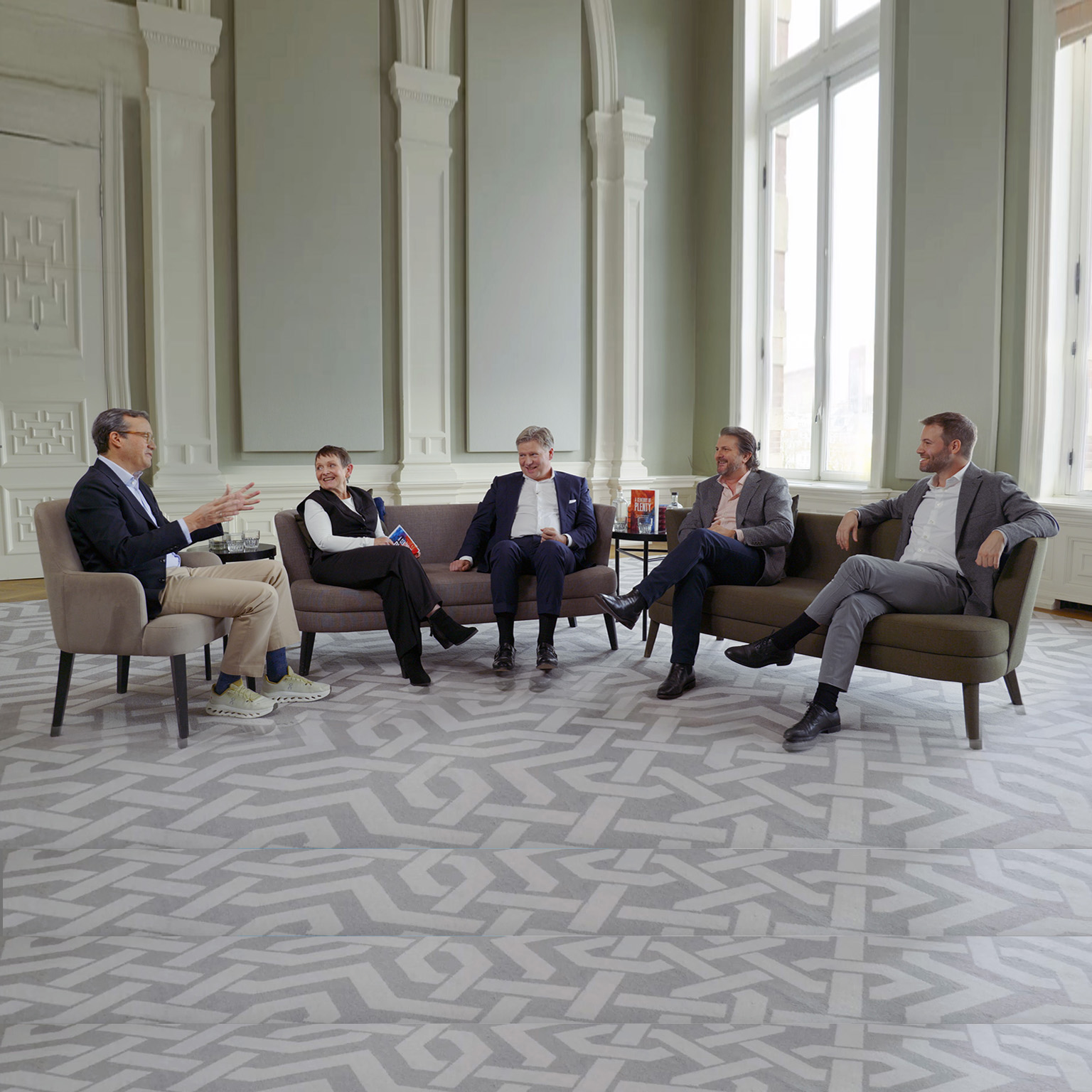 Chris Bradley, Nick Leung, Sven Smit, Janet Bush, and Marc Canal sitting and talking together.