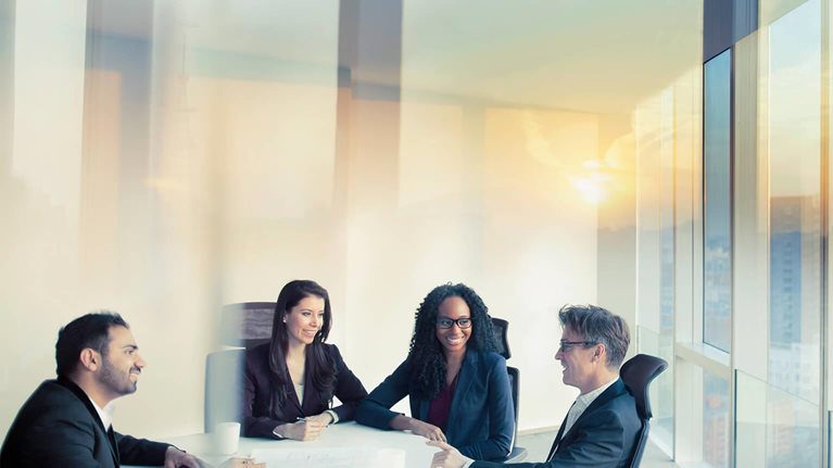 Business colleagues talking in meeting room