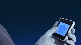 Hands holding electronic device