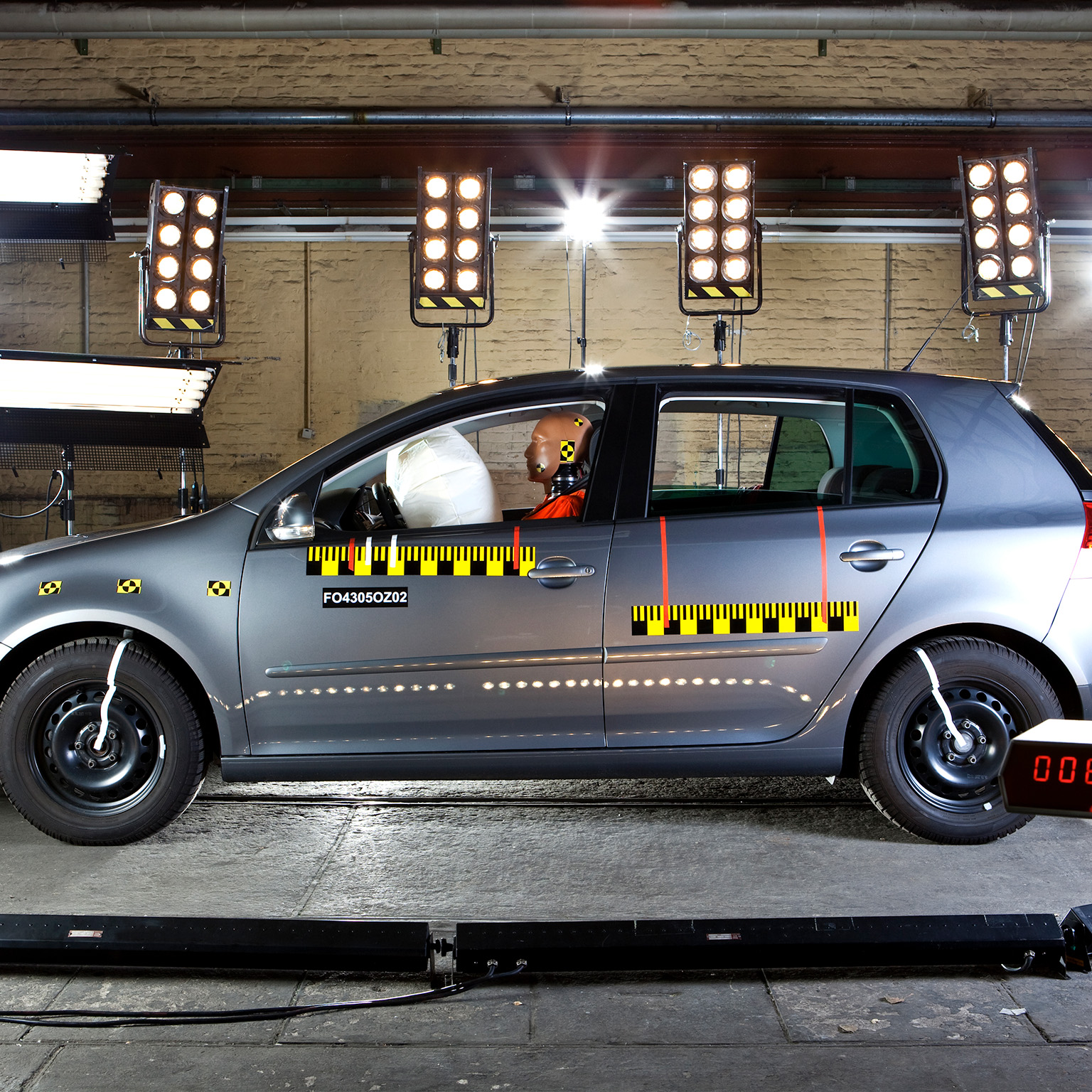 Automotive crash test with test dummy and measurement sensors
