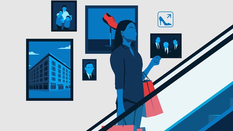 A woman holding shopping bags travels up the escalator of a department store. Behind her are photos representing the life of the store's owner.
