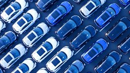 Aerial view of cars parked in many rows