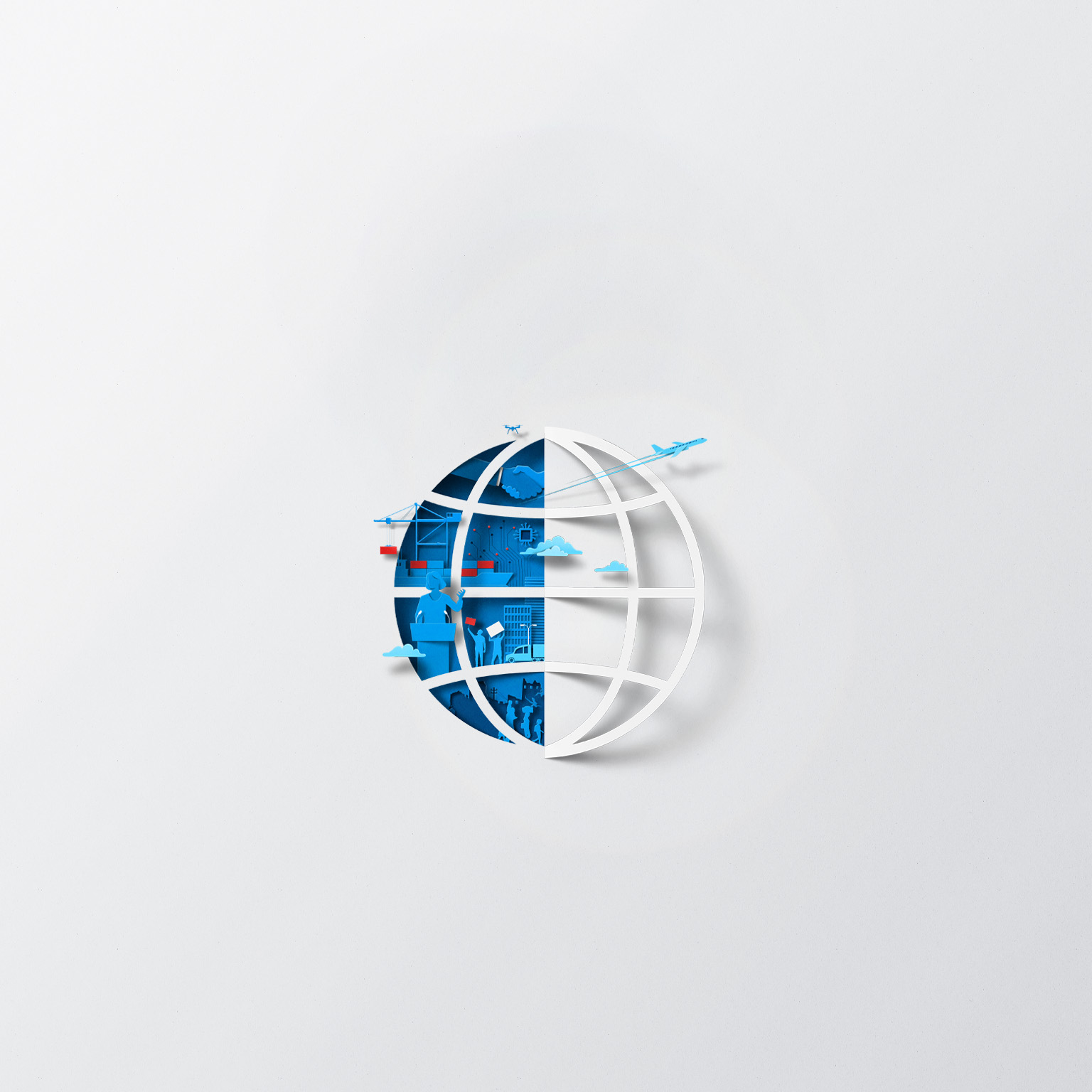 A white sheet of paper has been cut and folded in half, creating the silhouette of a globe. The open space left by the folded paper is filled with blue and red shapes, representing international trade, transportation, and geopolitics.