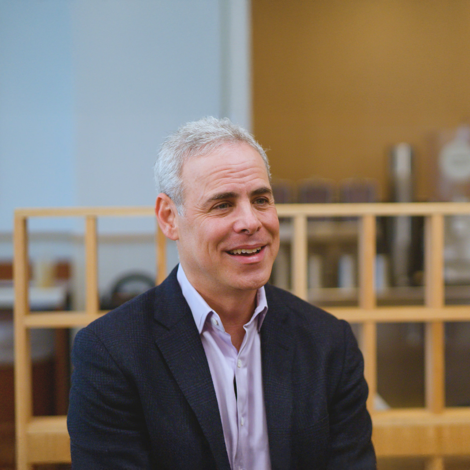 Image of Brett Schulman smiling during an interview.